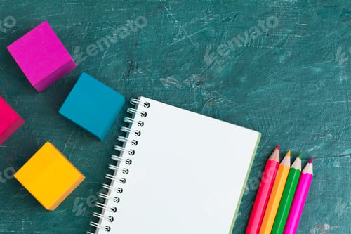 Preview: Notepad on wooden table and wood alphabet blocks