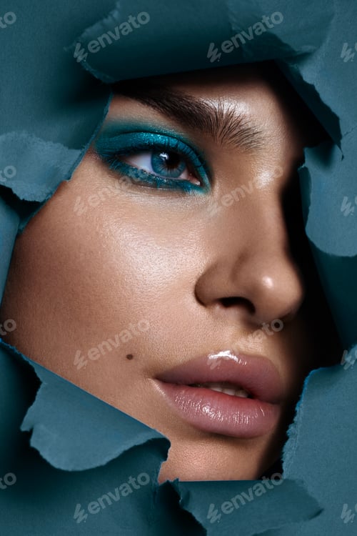 Preview: Beautiful woman with perfect skin on blue background. Beauty and skin care concept.