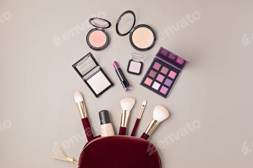 Preview: Flat lay with set of professional decorative cosmetics, makeup tools and woman accessories over gray
