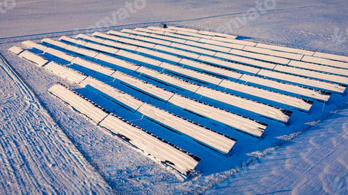 Preview: Snowy solar panels in cold winter. Alternative energy in winter.
