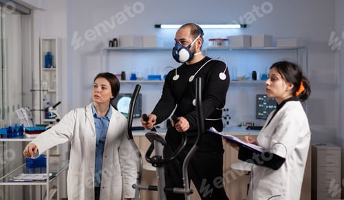 Preview: Medical team monitoring body endurance of sportman analyzing EKG data