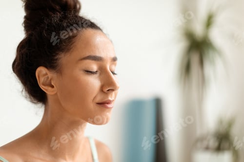 Preview: Woman Meditating at Home with Curly Hair