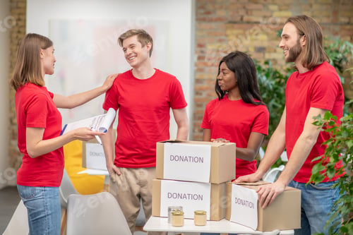 Preview: A group of young volunteers at work in a distribution point