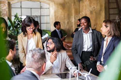 Preview: Group of businessmen gathered discussing the introduction of renewable energies