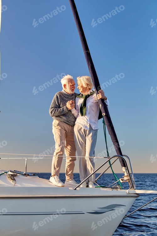 Preview: In love. Full length of happy senior couple holding hands and looking at each other