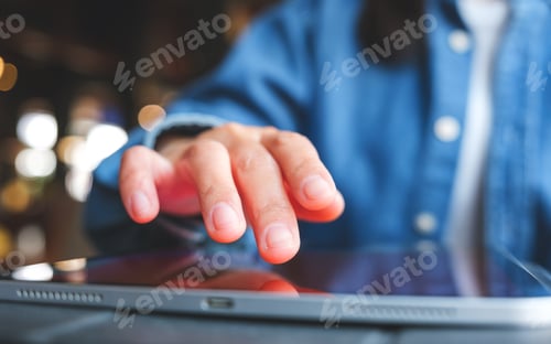Preview: Closeup image of a hand touching on digital tablet screen