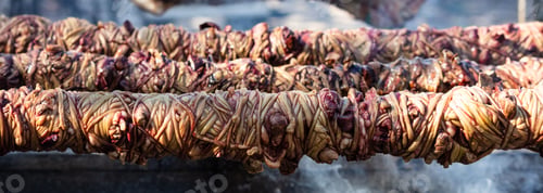 Preview: Kokorec spits on coals fire, banner. Greek Easter, Monastiraki, Athens Greece