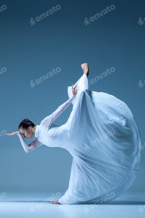 Preview: Portrait Of The Modern Ballerina In White Dress On Blue Background