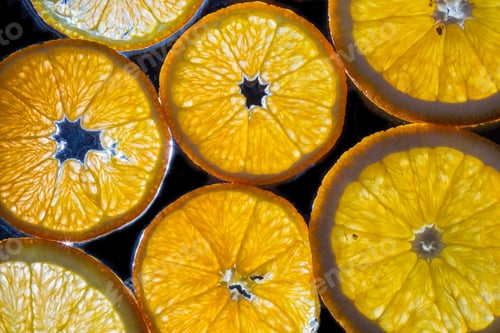 Preview: transparent slices of oranges and lemons on the glass