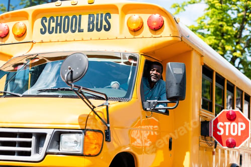 Preview: handsome senior school bus driver looking at camera through window