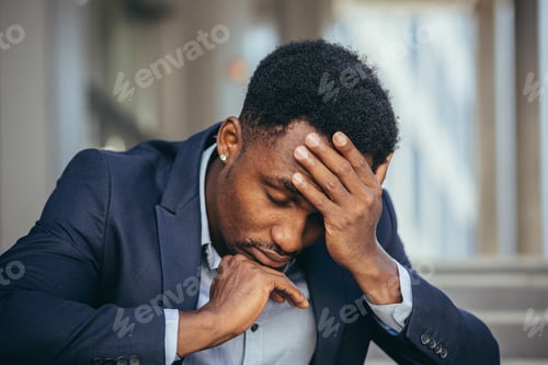 Preview: African american businessman in business suit frustrated got bad news from work