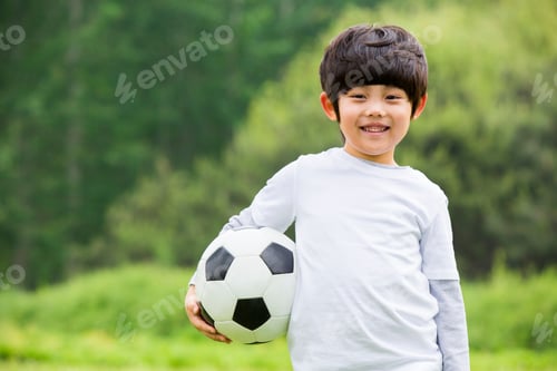 Preview: Portrait of little Chinese boy with football