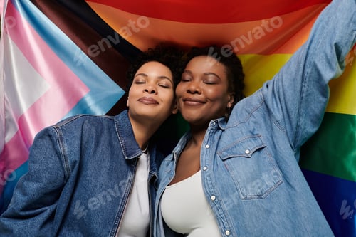 Preview: Loving couple celebrates their vibrant fashion and unity against a colorful pride backdrop