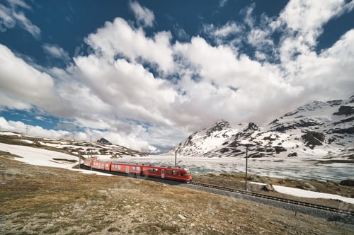 Preview: Red train in the Swiss Alps in the spring thaw