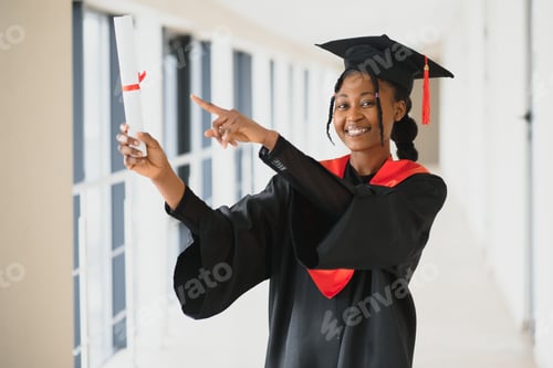 Preview: beautiful young afro american graduate holding diploma