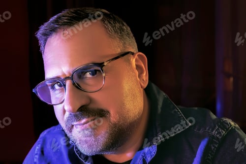 Preview: self-portrait with colored led lights, and eyeglasses.