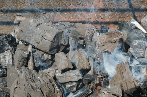 Preview: Charcoal Embers Close-up Background or Texture Black