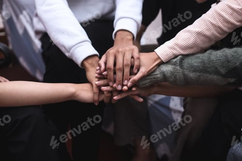 Stack of hands showing unity and teamwork