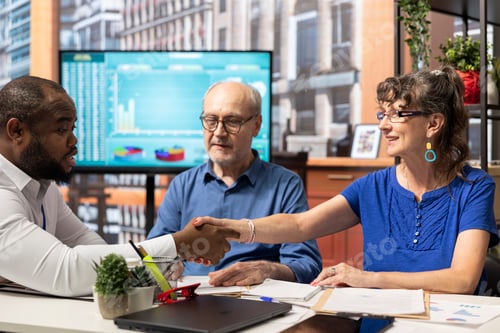 Preview: Business Meeting Concludes with a Handshake