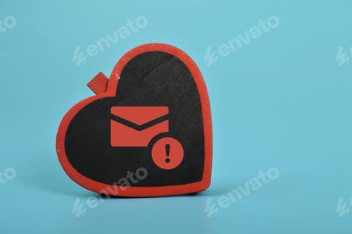 Preview: Love board and email symbol. The concept of love scams online involves using email phishing scams