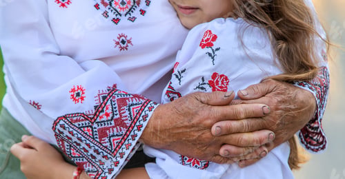 Preview: Ukrainian grandmother and granddaughter in vyshyvanka. selective focus.