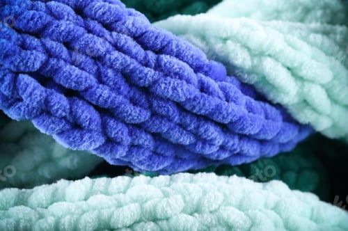Preview: Knitted Scarf Lies On The Table Background Image