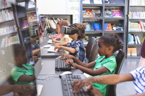 Preview: Caucasian schoolboy using virtual reality headset while his schoolmates working on computer