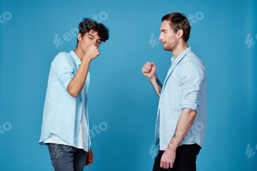 Preview: curly-haired guy in a shirt greets his friend on a blue background