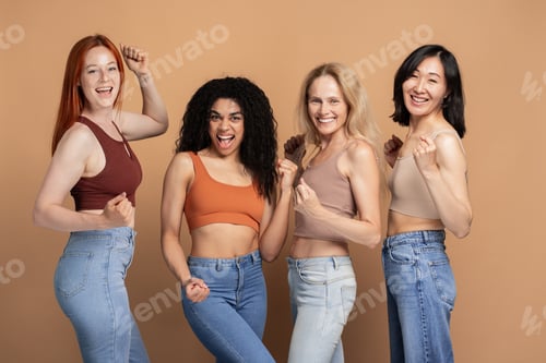 Preview: Diverse group of multiracial women wearing stylish tank top celebrating isolated on beige background