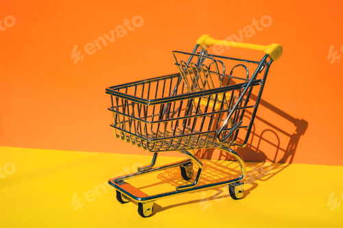 Preview: Empty shopping trolley cart on colorful orange yellow background. Copy space for your text. Online
