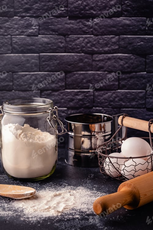 Preview: Table with baking products and tools.