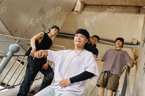 Preview: Group of Young Men Hanging Out on Staircase Outdoors