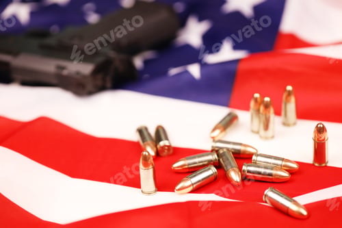 Preview: Many yellow 9mm bullets and gun on United States flag
