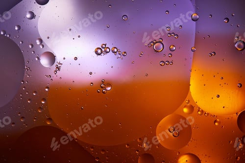 Preview: Beautiful abstract background from mixed water and oil in orange and purple color