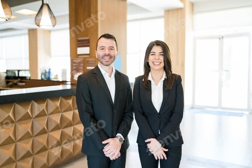 Preview: Happy Colleagues Wearing Suits In Lobby
