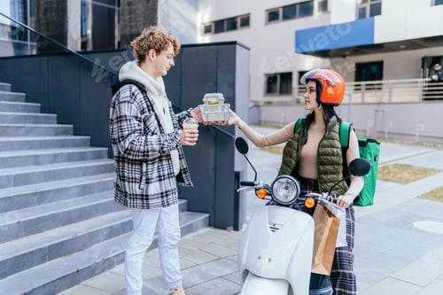 Preview: Courier service worker on bike delivers food to customer