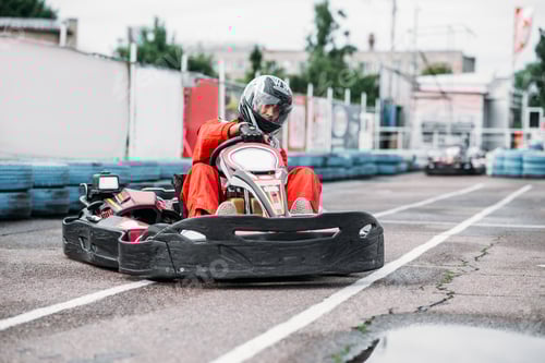 Preview: Adult in Go-Kart Ready to Race Outside