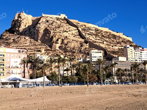 Preview: Majestic Castell de Santa Barbara silhouetted against a clear blue sky