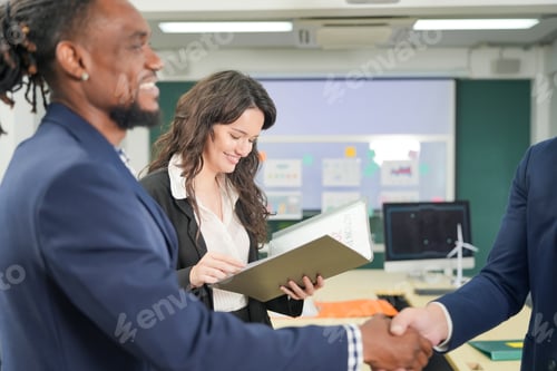 Preview: Business people working on business project in office. hand shaked and unity concept.
