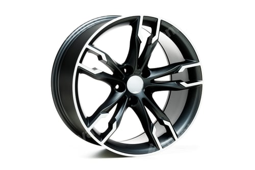 Preview: Closeup shot of a metal car wheel isolated on a white background