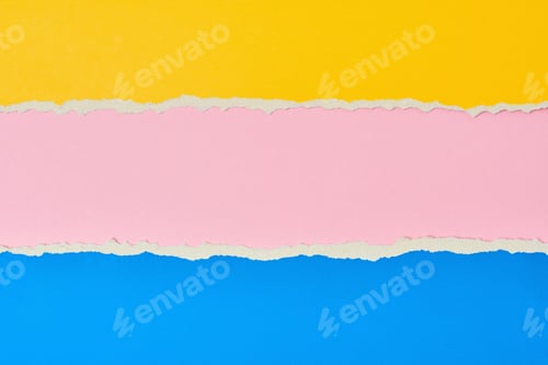 Preview: Torn ripped paper edge with a copy space, pink, yellow and blue color background