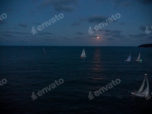 Preview: Luxury yachts at Sailing regatta at fool moon night.
