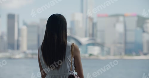Preview: Woman look at the city of Hong Kong
