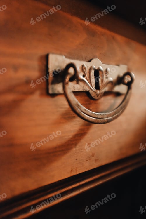 Preview: detail of a handle on a beautiful old wooden cabinet