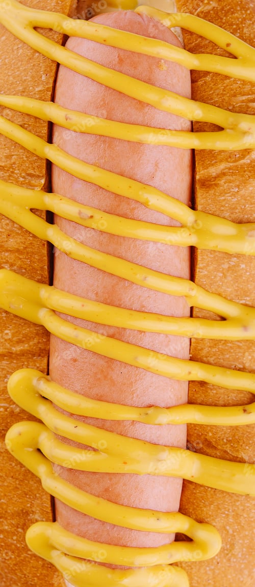 Preview: Hot dog with mustard closeup background