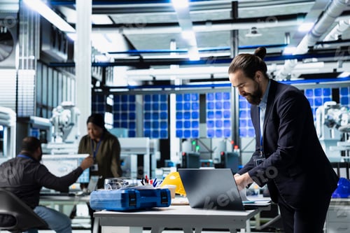 Preview: Solar panel master engineer in a high tech factory doing an inspection