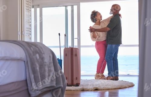 Preview: Mature Couple With Luggage Dancing In Beachfront House Overlooking Ocean For Summer Vacation
