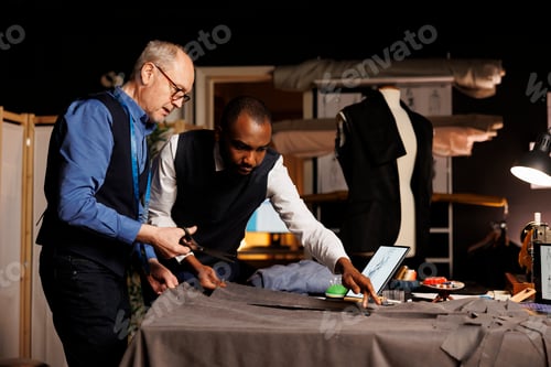 Preview: Two Men Working on Design in Tailor Shop