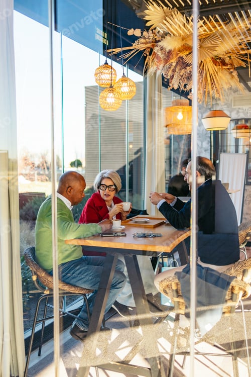 Preview: Group of friends chatting over coffee at a cozy cafe