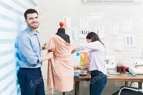 Preview: Male and female dressmakers trying new style at workshop